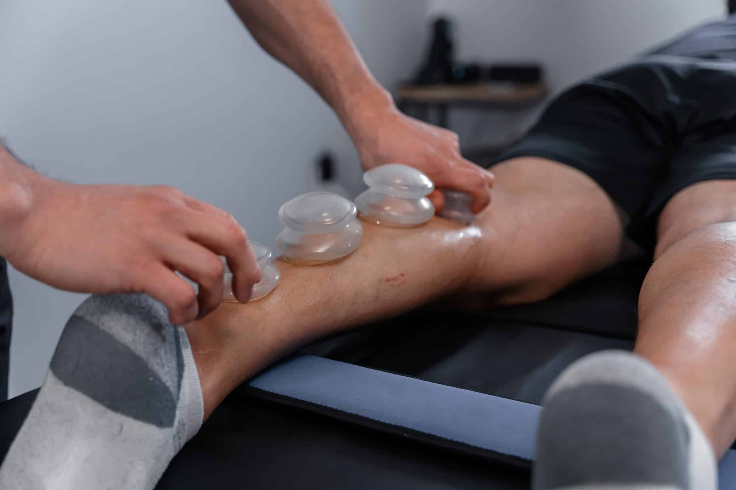 A cupping therapy session in progress at Scott Shaheen Personal Training Fitness & Wellness. Specializing in personal training and fitness coaching, nutrition and lifestyle coaching, and pain management techniques such as fascial stretch therapy, red light therapy, cupping therapy and gua sha scraping therapy. Located in Woodstock Ontario.